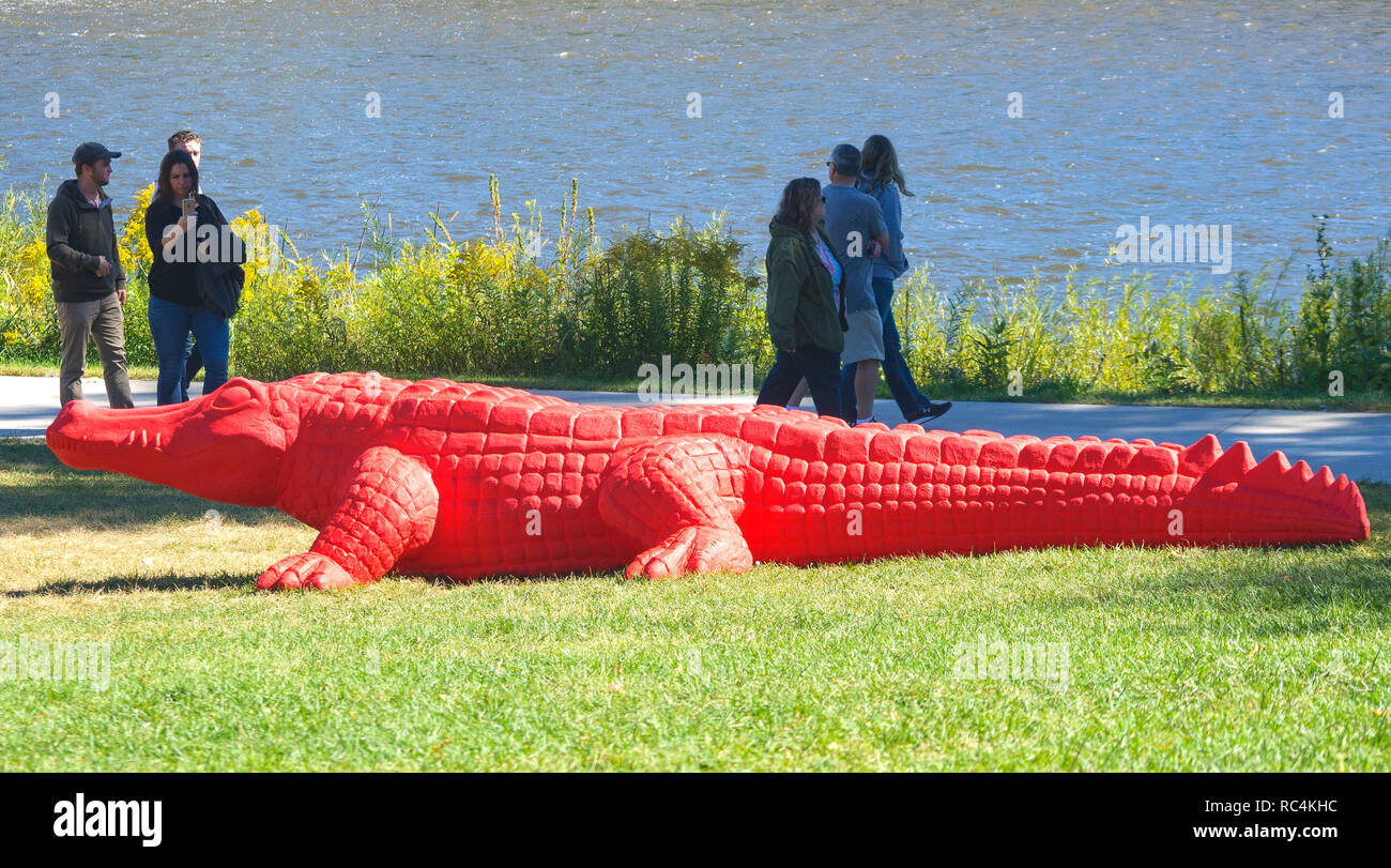 Grand Rapids, Michigan / United States - September 22, 2018:  People enjoying the Alligator Exhibit at Art Prize Stock Photo