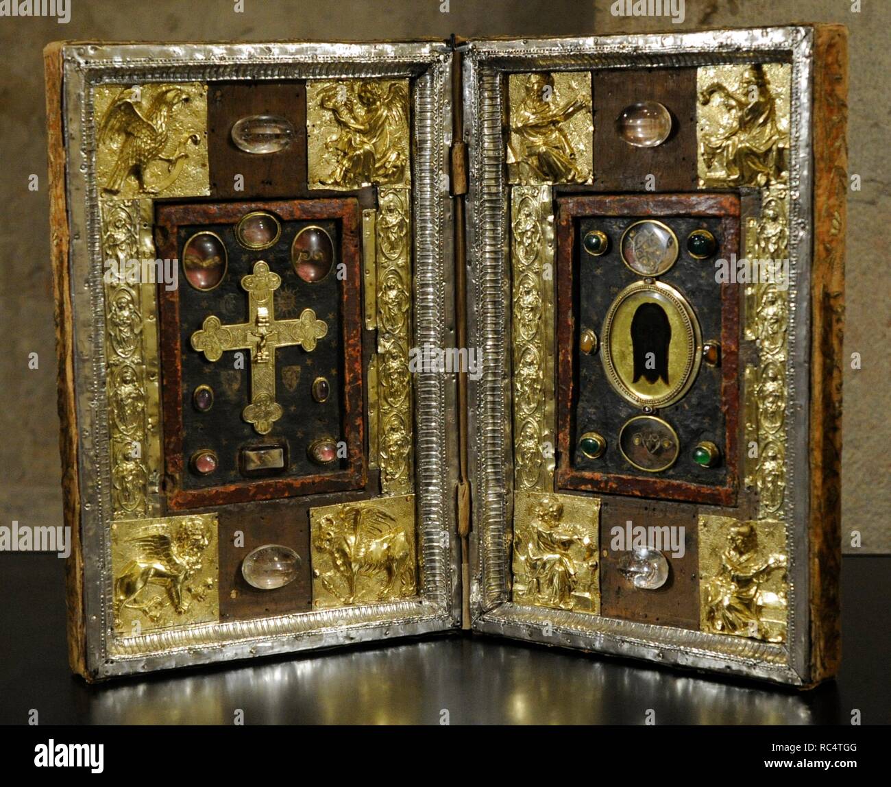 Reliquary Diptych. 14th century with later modifications. France. Reliefes: silver, repousse and gilded. Varieties of wood, painting, klosterarbeit, rock crystal, glass, reverse glass painting, decoratives stones. Museum Schnu tgen. Cologne, Germany. Stock Photo