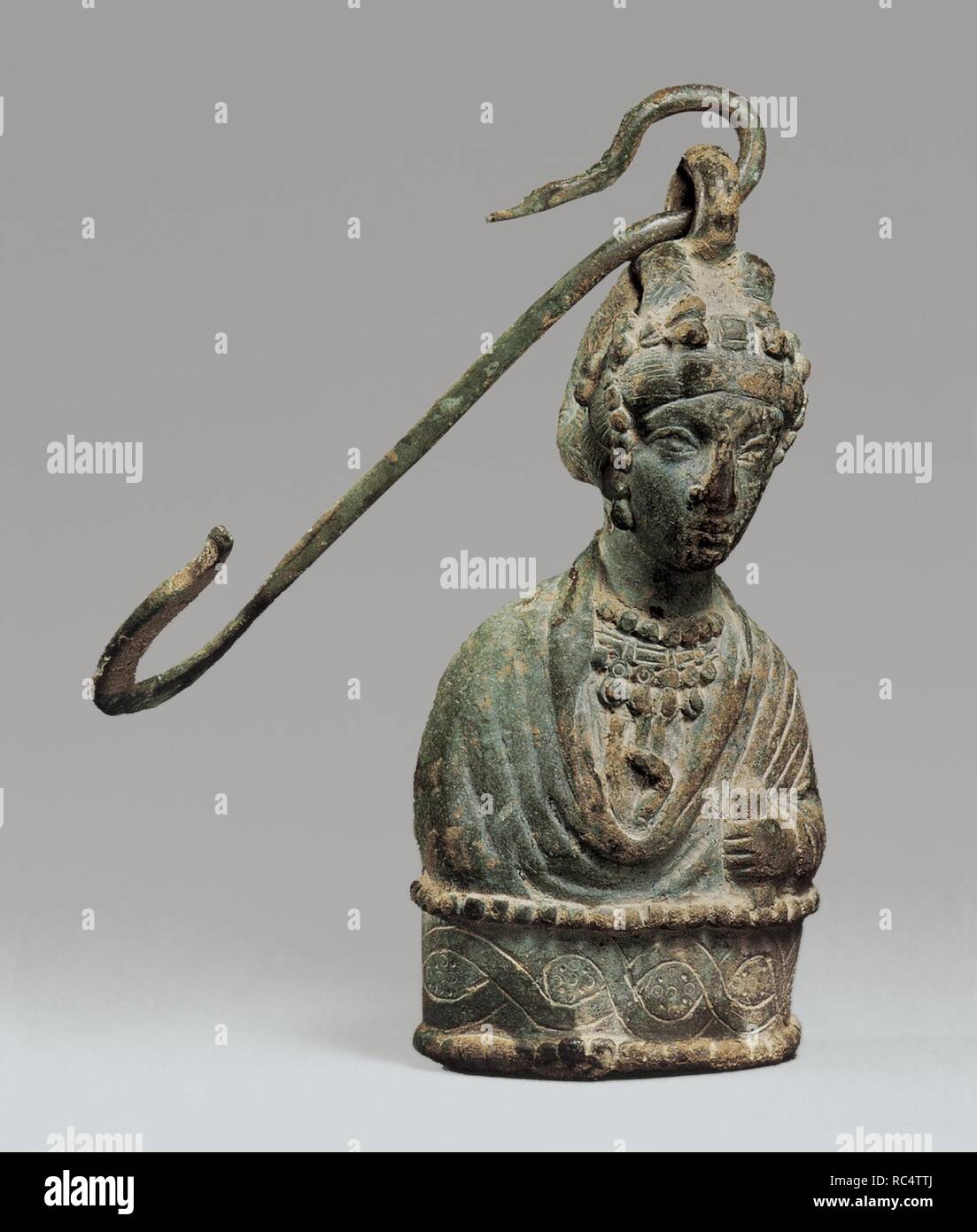 Steelyard Weight with a Bust of a Byzantine Empress and a Hook. Culture: Byzantine. Dimensions: 9 1/2 × 4 1/2 × 2 13/16 in., 12.5 lb. (24.2 × 11.5 × 7.1 cm, 5664g)  Other (Hook): 8 7/8 × 3 × 1 1/4 × 1/4 in., 0.4 lb. (22.6 × 7.6 × 3.2 × 0.7 cm, 176g). Date: 400-450.  Steelyard weights often took the shape of busts of Byzantine empresses. This unusually detailed image may depict an empress of the Theodosian dynasty, which ruled from 379 to 450. The weight--itself about five pounds, or seven Byzantine litrae--would have been used for heavier goods. Museum: Metropolitan Museum of Art, New York, US Stock Photo
