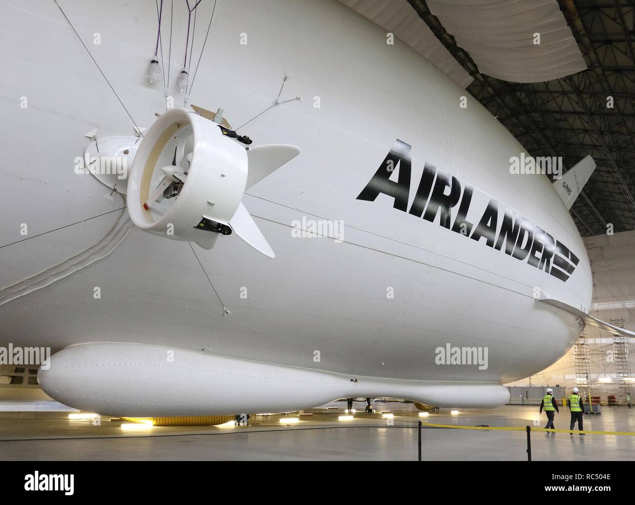 View of the Airlander, the longest aircraft in the world. The £32m aircraft - nicknamed 'The Flying Bum' was originally unveiled to the public at a naming ceremony by HRH The Duke of Kent in April 2016, but a few weeks later it crashed at the end of a test flight. At 92-metre long, the Airlander 10 is the longest aircraft in the world.  The world's longest aircraft has been retired from service as developers prepare to start work on a new model. Stock Photo