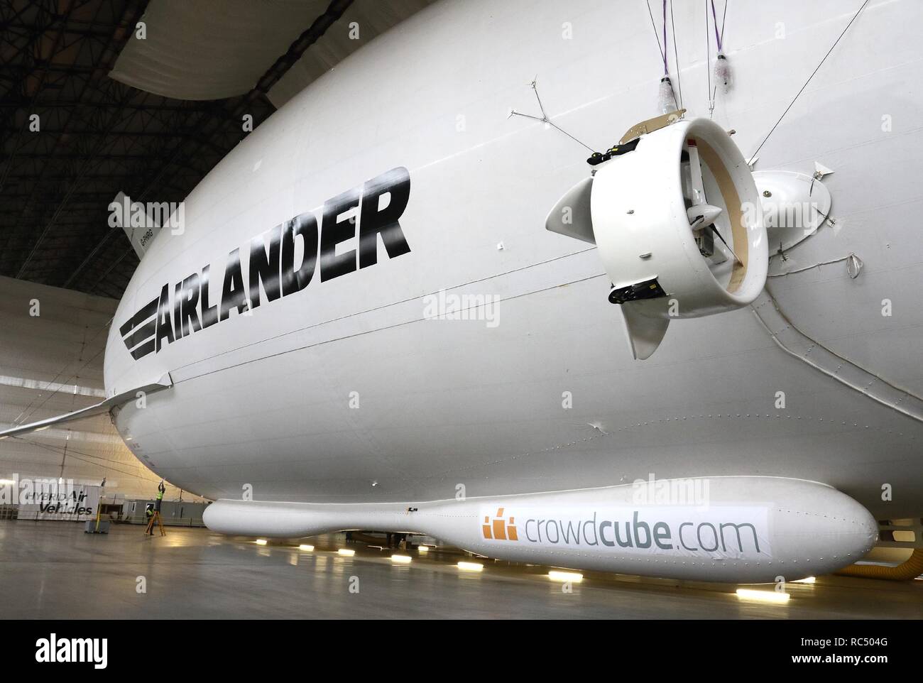 View of the Airlander, the longest aircraft in the world. The £32m aircraft - nicknamed 'The Flying Bum' was originally unveiled to the public at a naming ceremony by HRH The Duke of Kent in April 2016, but a few weeks later it crashed at the end of a test flight. At 92-metre long, the Airlander 10 is the longest aircraft in the world.  The world's longest aircraft has been retired from service as developers prepare to start work on a new model. Stock Photo