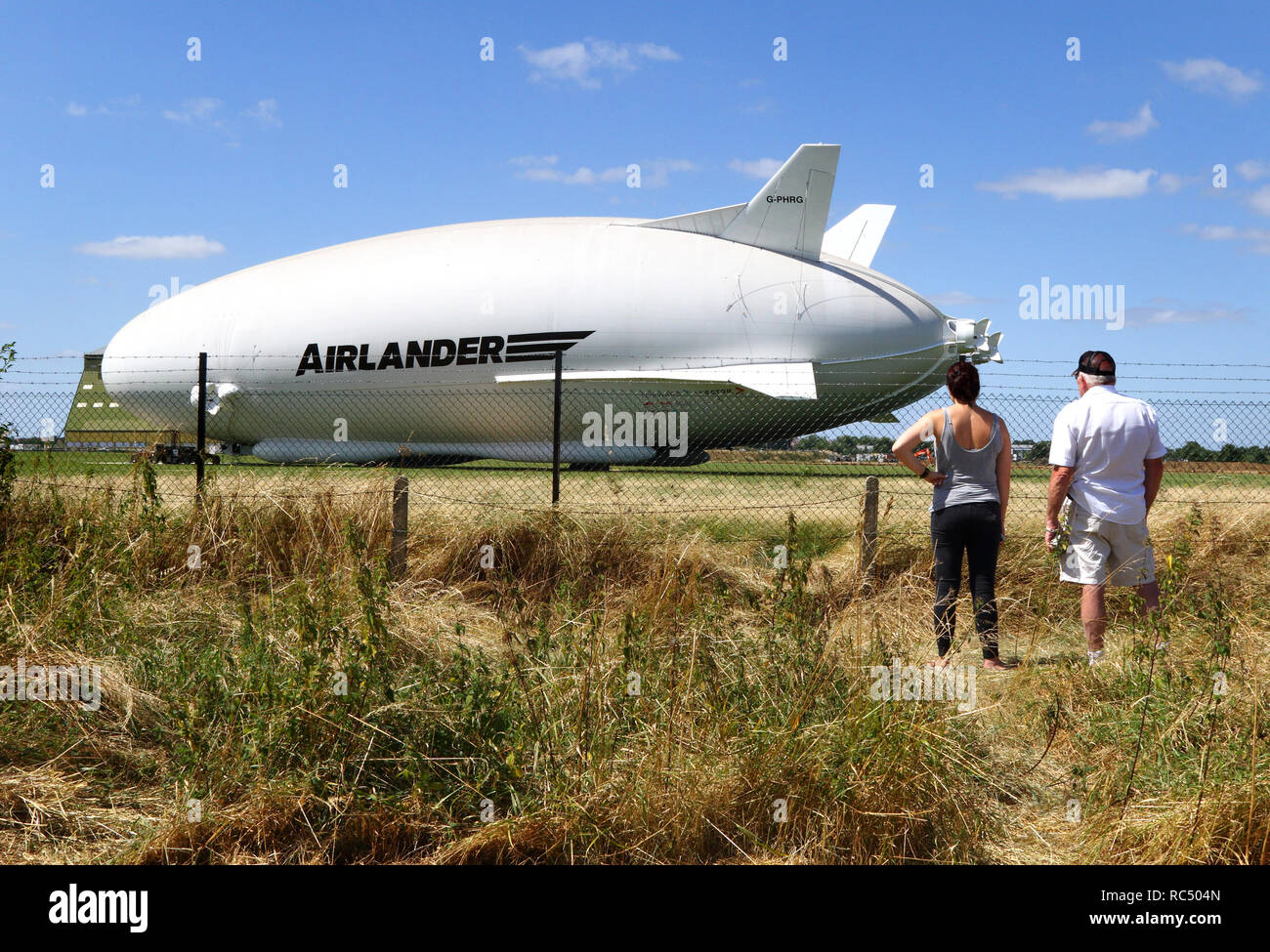 View of the Airlander, the longest aircraft in the world. The £32m aircraft - nicknamed 'The Flying Bum' was originally unveiled to the public at a naming ceremony by HRH The Duke of Kent in April 2016, but a few weeks later it crashed at the end of a test flight. At 92-metre long, the Airlander 10 is the longest aircraft in the world.  The world's longest aircraft has been retired from service as developers prepare to start work on a new model. Stock Photo