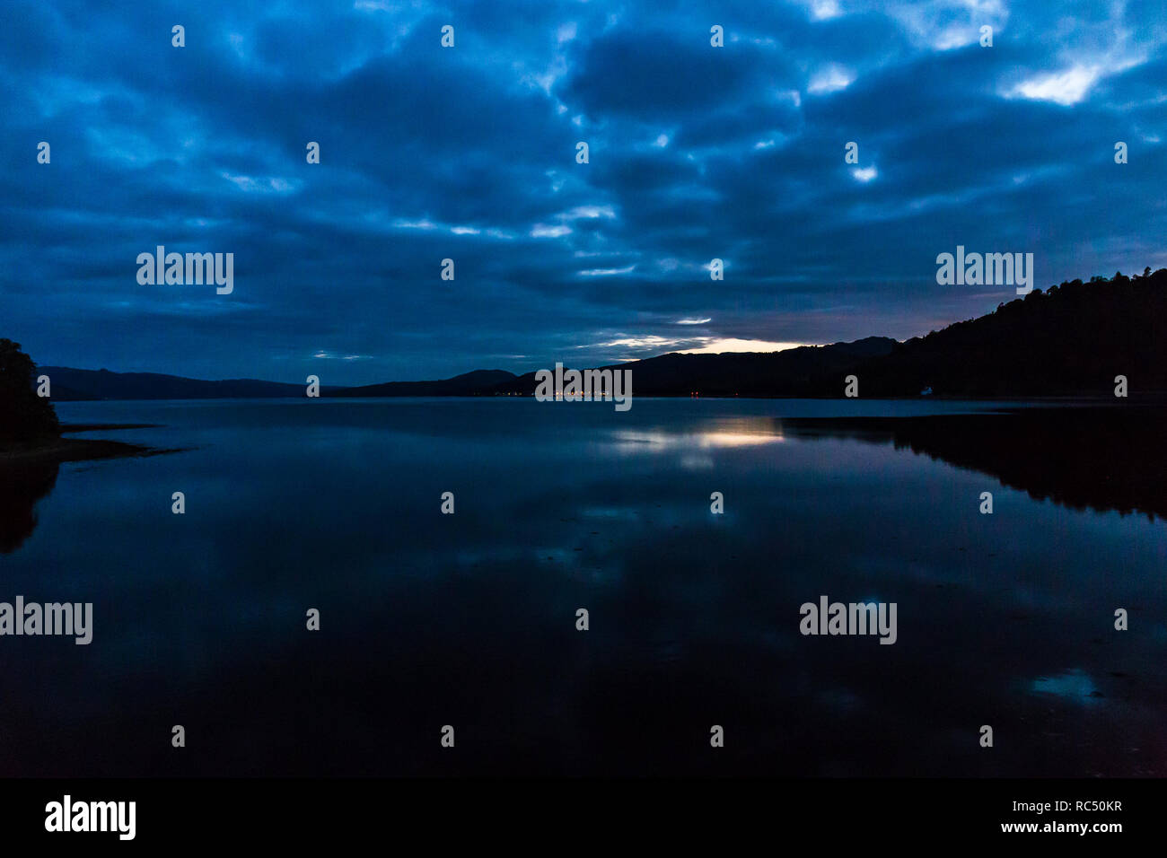 View across Loch Fyne towards Inveraray at night in Scoltand, UK. Stock Photo