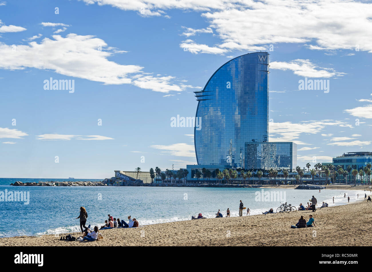 Barcelona, Spain - November 10, 2018: Sant Miquel beach, one of the city's oldest beaches, and W Barcelona, also known as the Hotel Vela (Sail Hotel)  Stock Photo