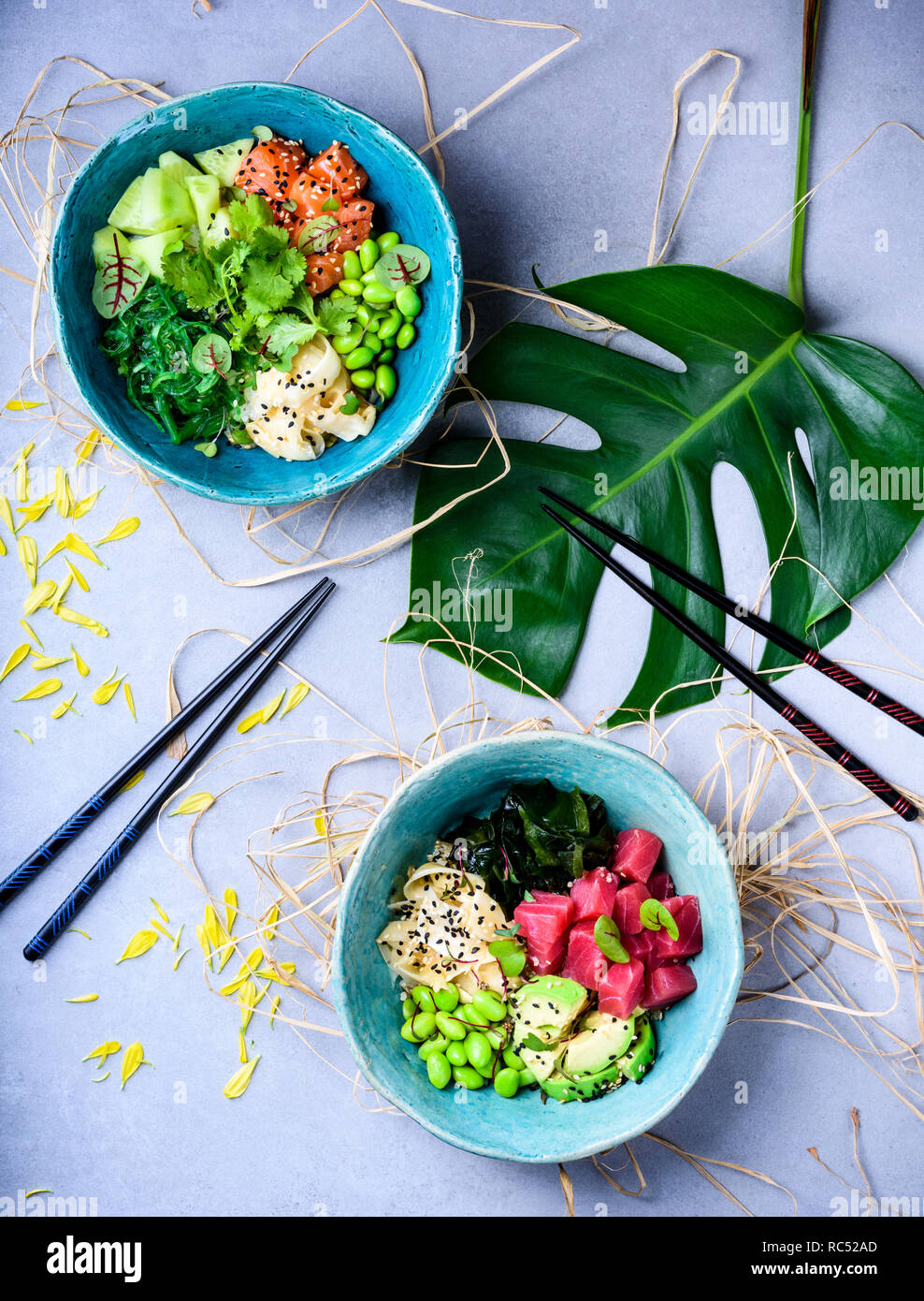 Hawaiian poke bowl with tuna and salmon, noodle and edamame. Asian