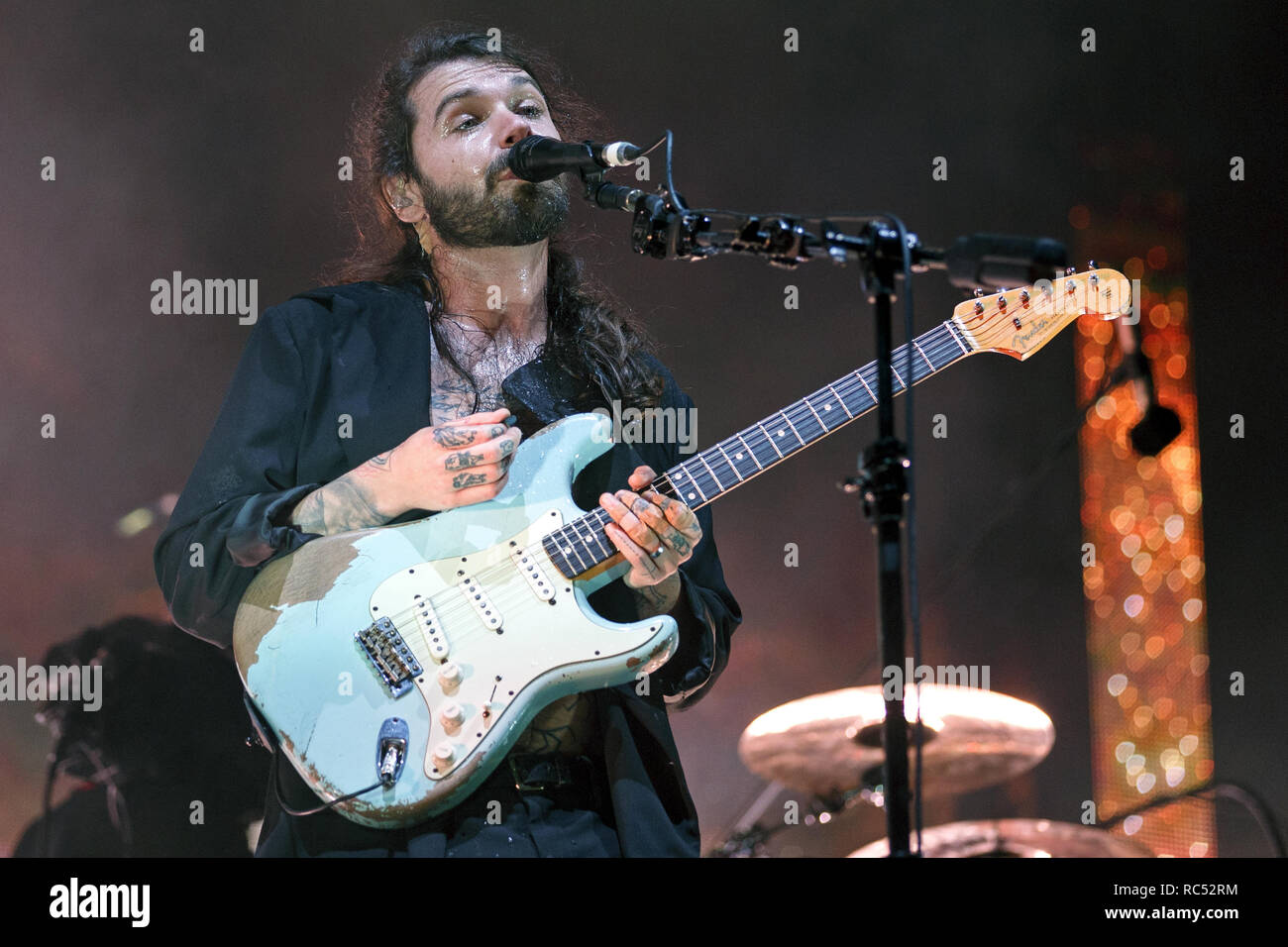 Simon Neil of Biffy Clyro onstage playing a worn Fender Stratocaster at a music festival. Stratocaster guitar, Fender Strat, Biffy Clyro lead singer. Stock Photo