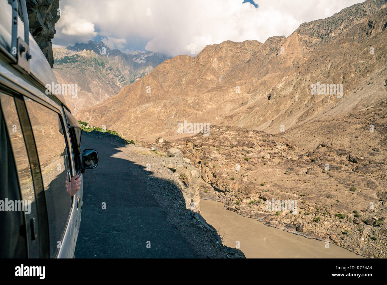 Driving on dangerous mountain roads in Pakistan on the edge of cliffs