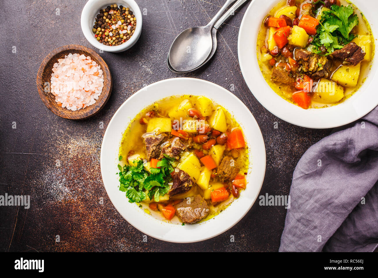 Traditional German eintopf soup with meat, beans and vegetables in a