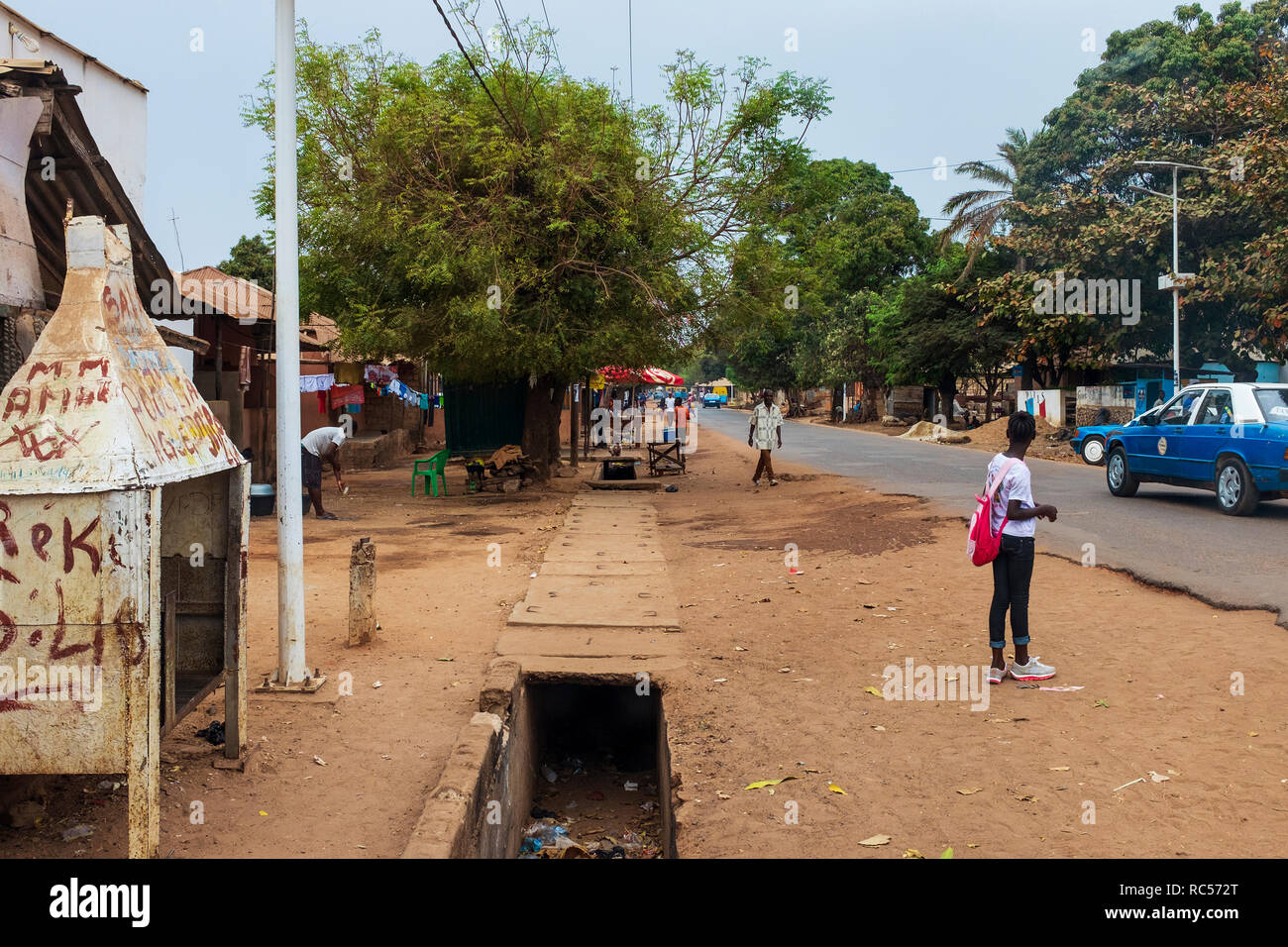 Bissau, Republic of Guinea-Bissau - February 6, 2018: Street scene at the Missira neighbourhood, with people on street, in the city of Bissau, Guinea  Stock Photo