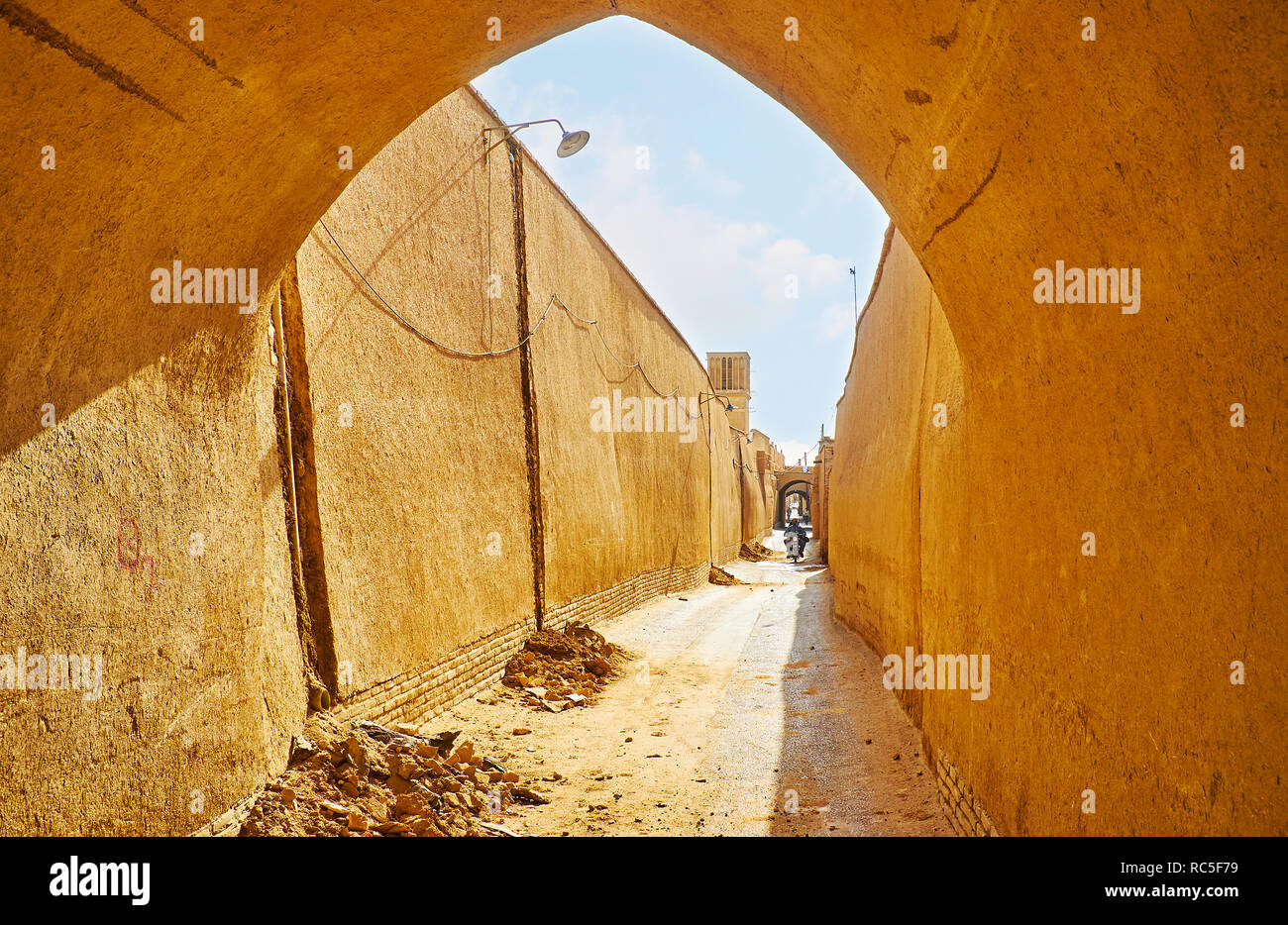 Visit historic neighborhoods of Yazd with preserved mudbrick buildings, kuche passageways and badgirs (windcatchers), providing cool air to the mediev Stock Photo