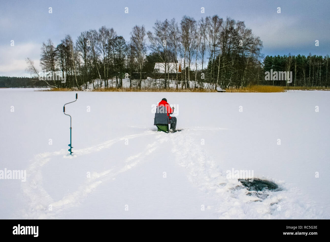 Ice fishing hole hi-res stock photography and images - Alamy