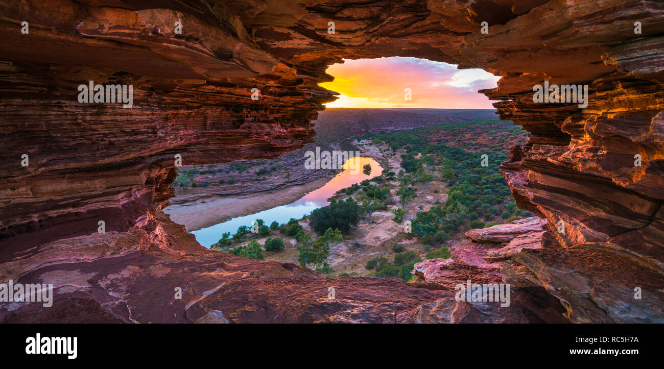Kalbarri National Park Australia. A view through Nature's Window sandstone rock formation of the Murchison River flowing through the gorge at sunrise. Stock Photo