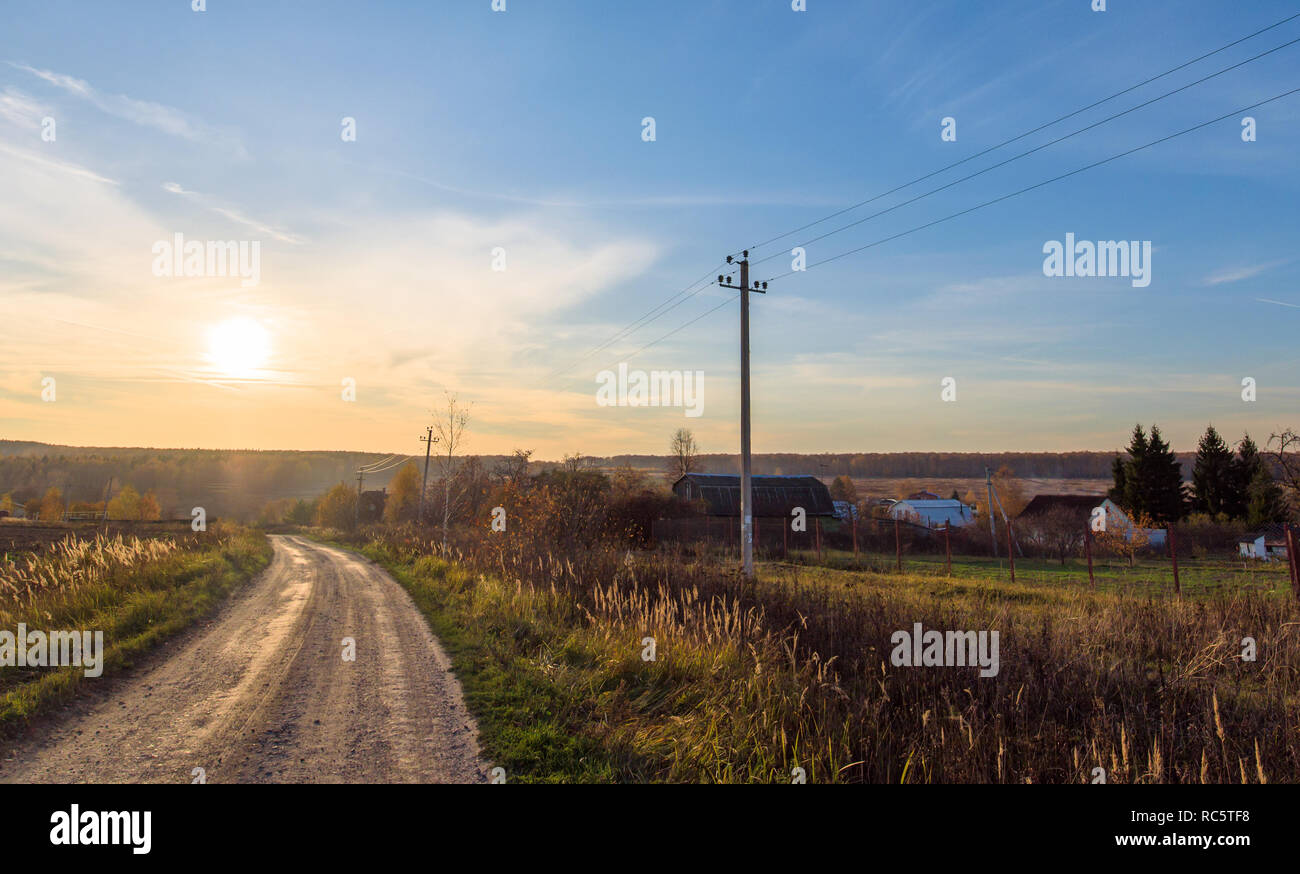 Sunset landscape on long summer country road Stock Photo - Alamy