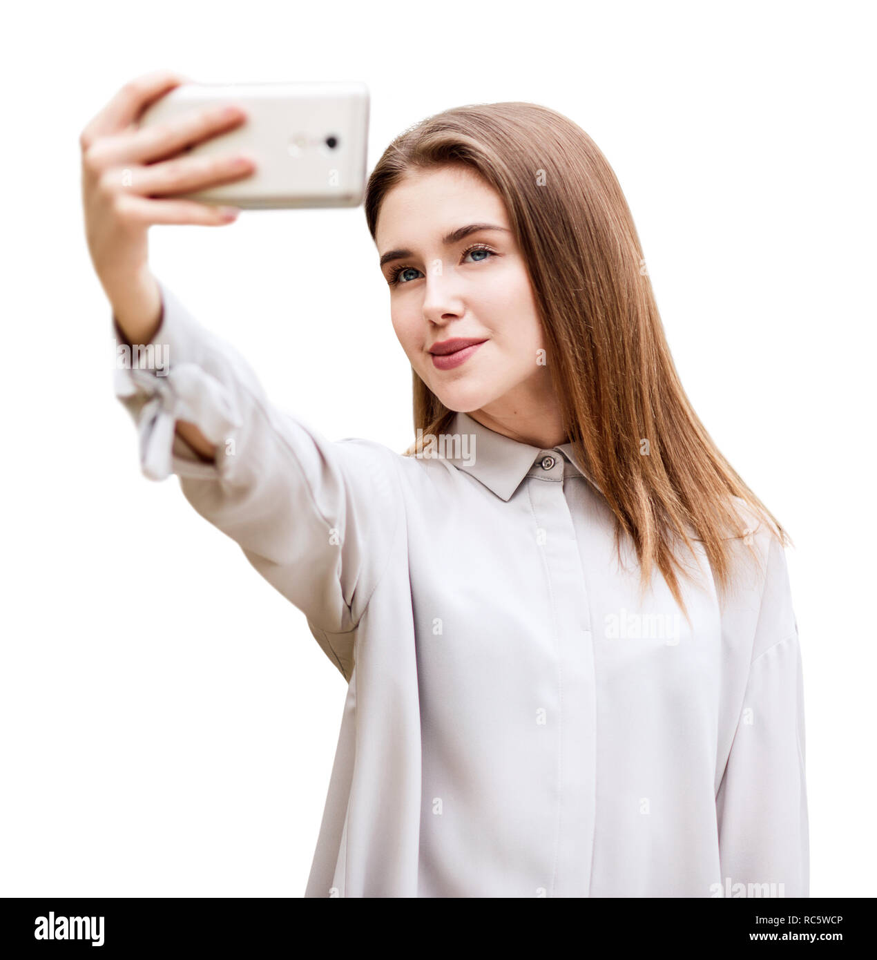 Beautiful girl makes selfie photo on smartphone. Stock Photo