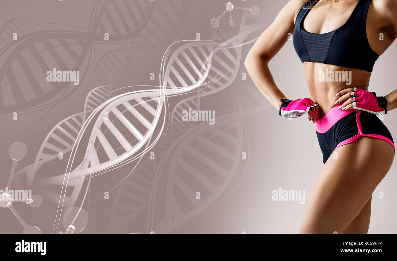 Athletic fitness woman standing among DNA chains. Stock Photo