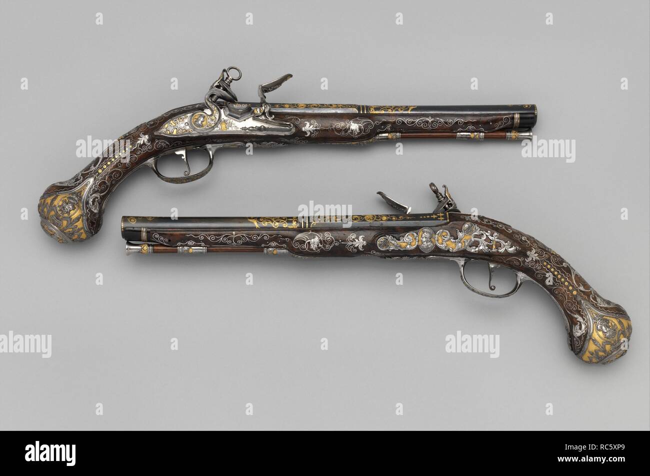 Pair of Flintlock Pistols Made for Ferdinand IV, King of Naples and Sicily (1751-1825). Barrelsmith: Emanuel Esteva (Spanish, active in Naples, Italy, recorded about 1768-73). Culture: Italo-Spanish, Naples. Dimensions: L. of each 17 3/8 in. (44.1 cm); L. of each barrel 11 1/16 in. (28.1 cm); Cal. .63 in. (16.0 mm); Wt. of each 2 lb. 4 oz. (1021 g). Gunsmith: Michele Battista (Spanish, active in Naples, Italy, recorded about 1760-90). Manufacturer: Royal Arms Manufactory at Torre Annunziata (Italian, Naples, established 1757). Date: ca. 1768.  The Royal Arms Factory in Naples was established i Stock Photo