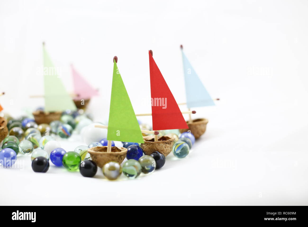 Marbles and ships from nuts Stock Photo