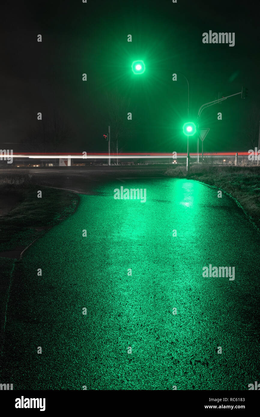 Traffic light showing green light in wet night Stock Photo Alamy