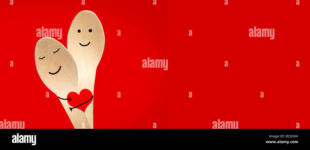 Happy couple hug concept, smiley painted on spoons, red valentines day ...