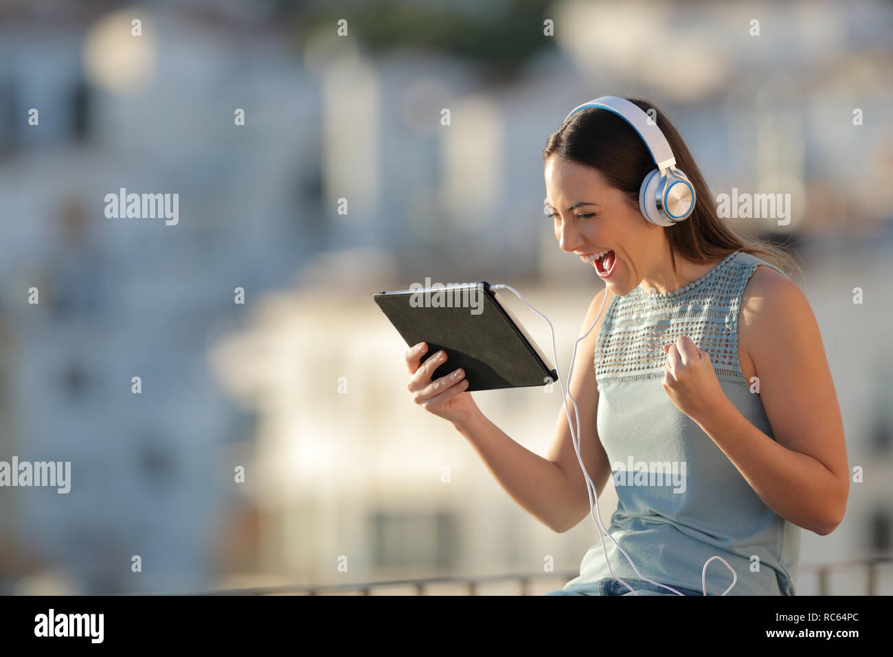 Woman watching sunset balcony hi-res stock photography and images - Alamy