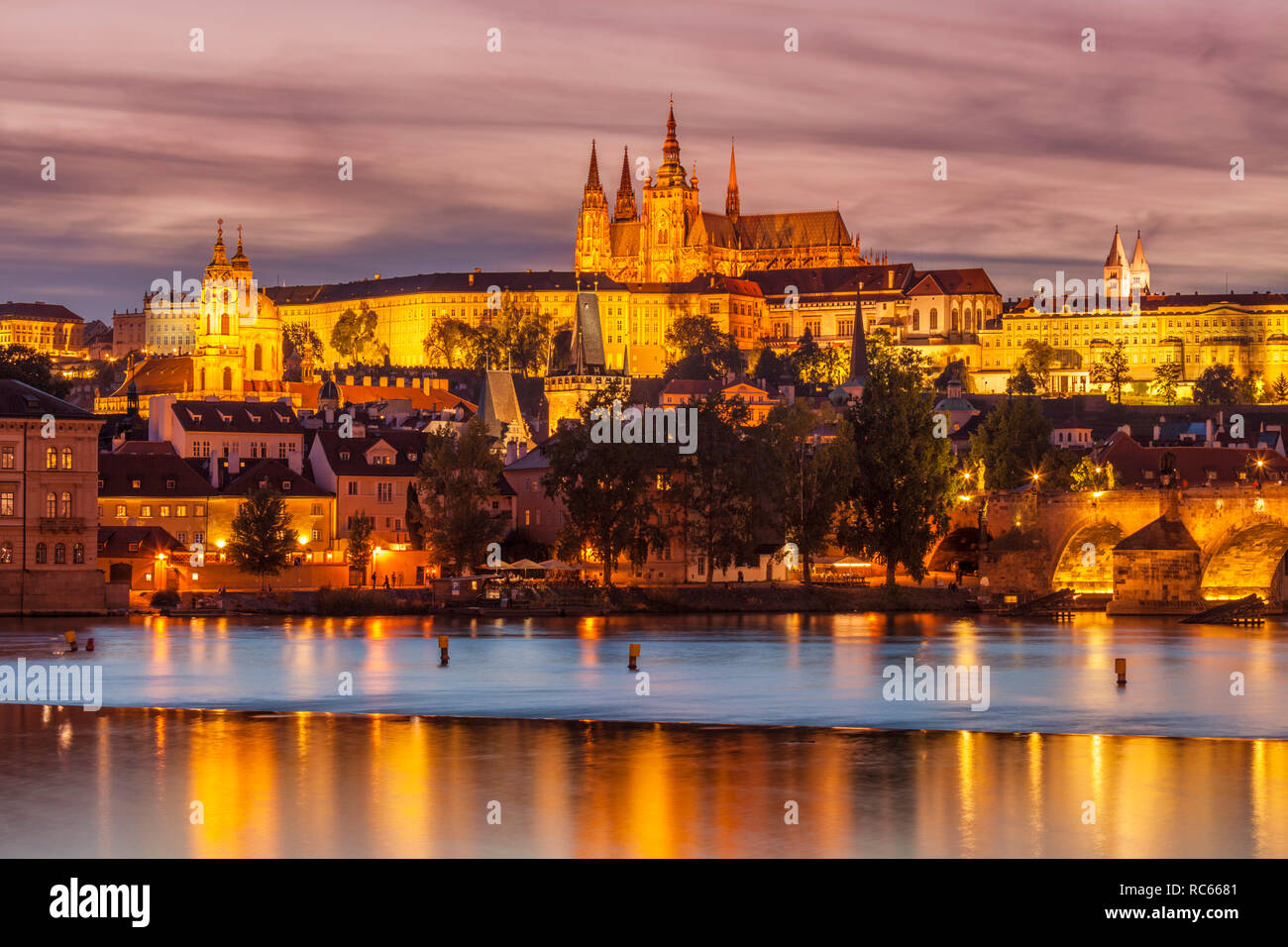 Prague skyline with Prague castle St Vitus cathedral at night  Mala Strana and Charles bridge night over river vltava Prague Czech republic Europe Stock Photo