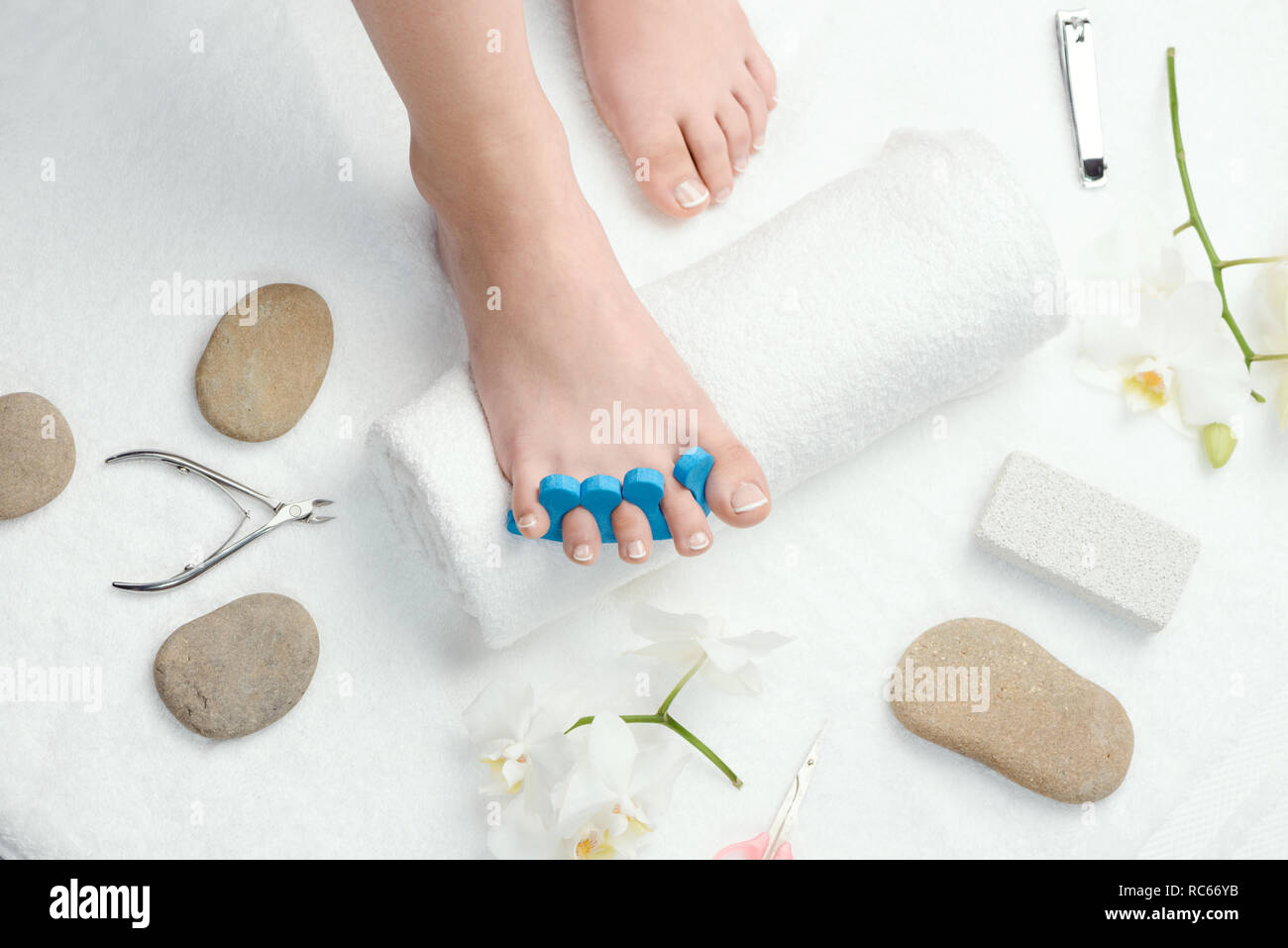 Woman's foot with toe separator Stock Photo