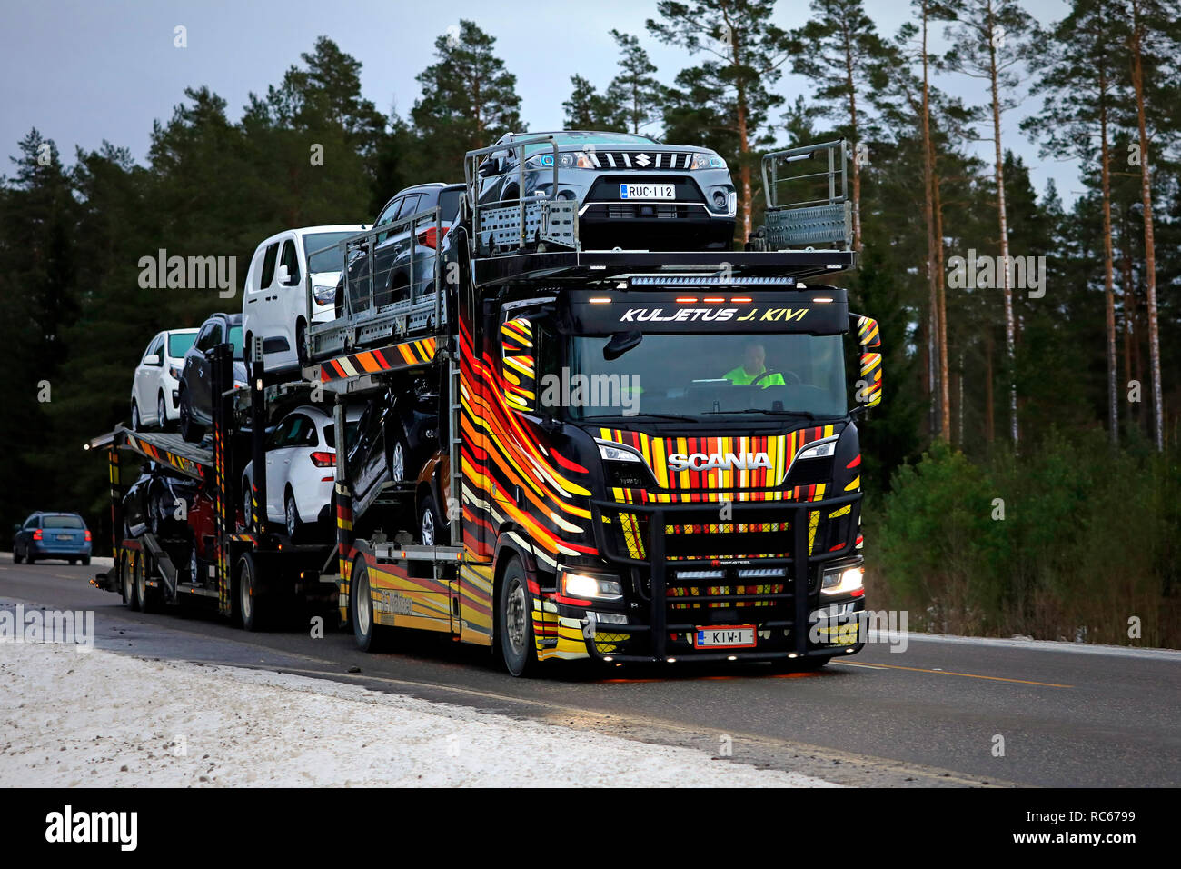 Salo, Finland - January 6, 2019: Spectacularly customised car carrier Scania R650 of Kuljetus J. Kivi hauls vehicles along road on a winter afternoon. Stock Photo