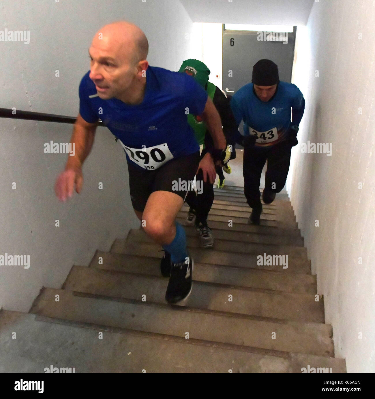 Berlin, Germany. 13th Jan, 2019. Participants in the 'Tower Run' in a high-rise building in Gropiusstadt run in the stairwell. Numerous athletes responded to the call for the 19th edition of the sporting event to run up the 465 steps to the 29th floor in different age groups. Credit: Paul Zinken/dpa/Alamy Live News Stock Photo