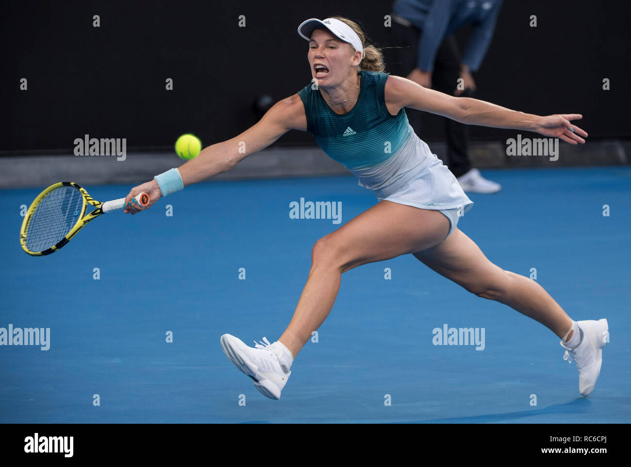Melbourne, Australia. 14th Jan, 2019. Caroline Wozniacki of Denmark hits a  return during women's single's first