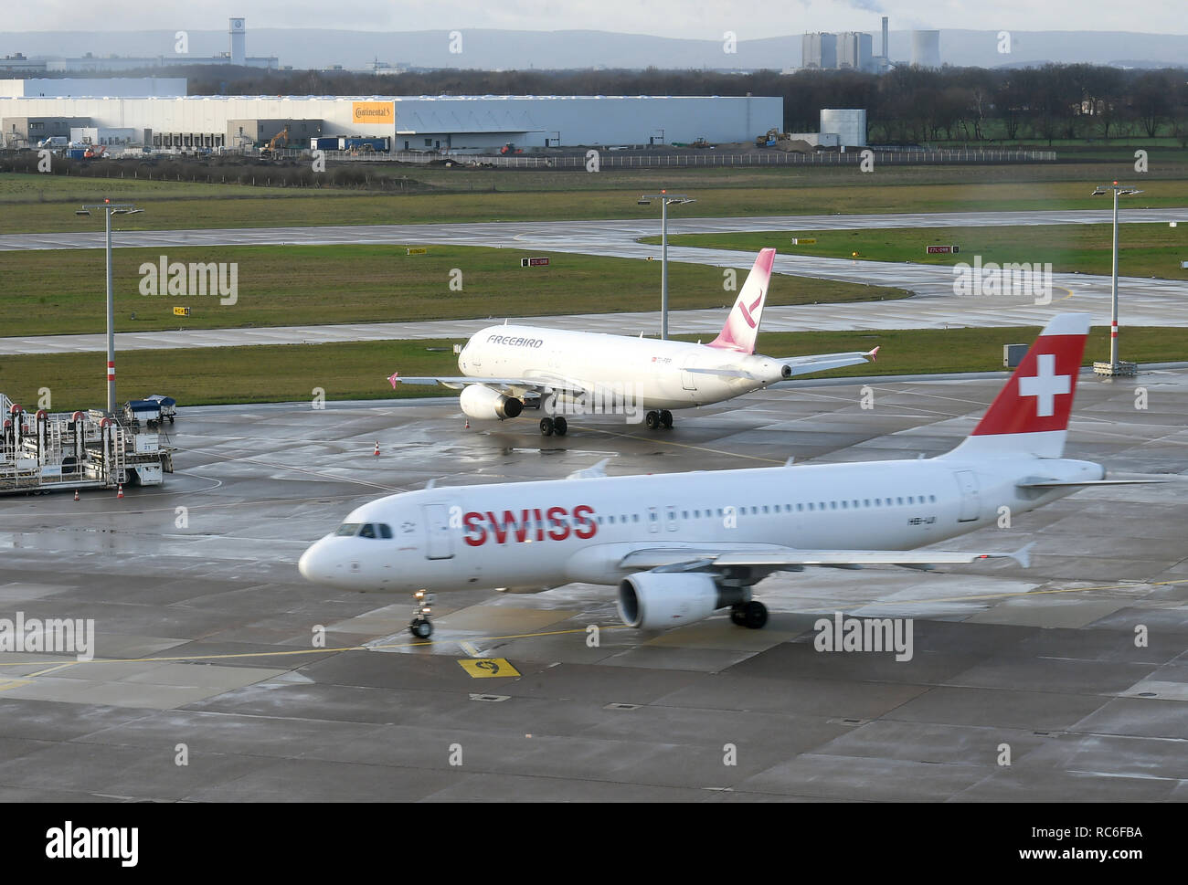 Hannover, Germany. 14th Jan, 2019. An Airbus A320-214 of Swiss International Air Lines is taxiing to the take-off position on the southern runway of the airport. Due to a warning strike announced on 15.01.2019, more than one third of the connections at Hanover Airport will be cancelled. According to Verdi, 500 employees at Hanover Airport are called on to go on a 24-hour warning strike. Credit: Holger Hollemann/dpa/Alamy Live News Stock Photo