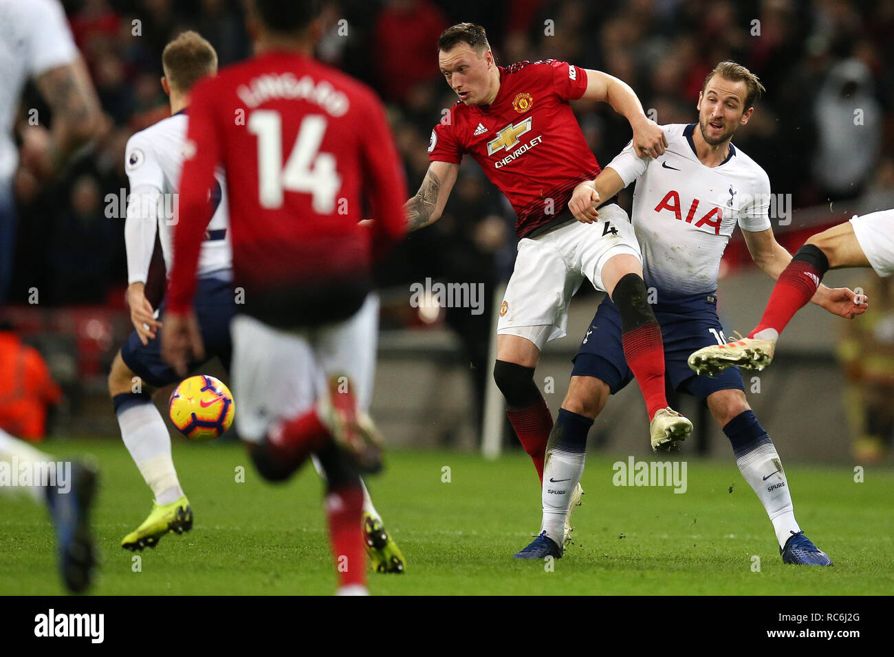 Harry Kane of Tottenham Hotspur is tackled by Phil Jones of Manchester United (4) . EPL Premier League match, Tottenham Hotspur v Manchester Utd at Wembley Stadium in London on Sunday 13th January 2019.  this image may only be used for Editorial purposes. Editorial use only, license required for commercial use. No use in betting, games or a single club/league/player publications . pic by Andrew Orchard/Andrew Orchard sports photography/Alamy Live news Stock Photo
