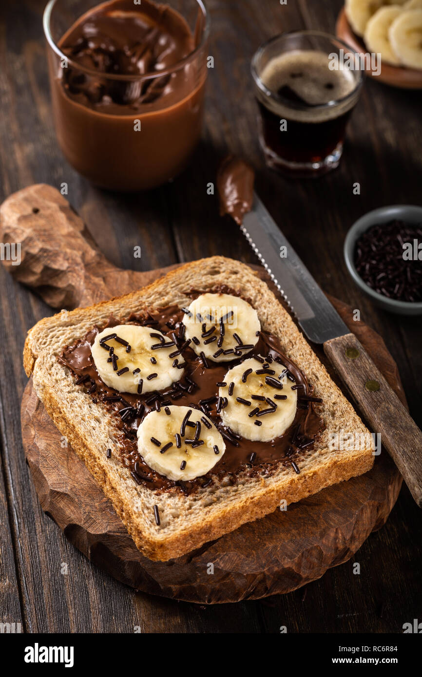 Delicious open sandwich with chocolate and banana Stock Photo