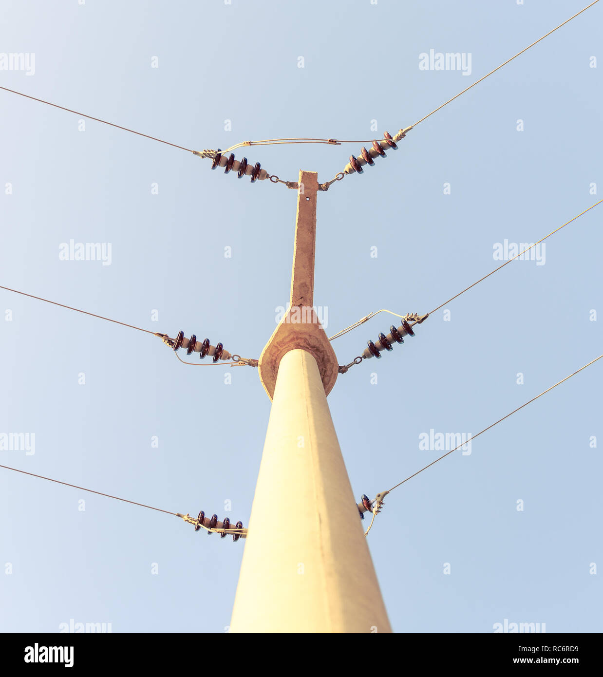 Power lines against a blue sky Stock Photo - Alamy