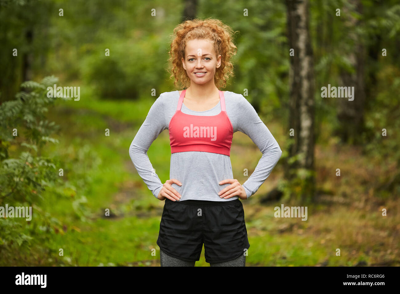 Sportswoman in the forest Stock Photo