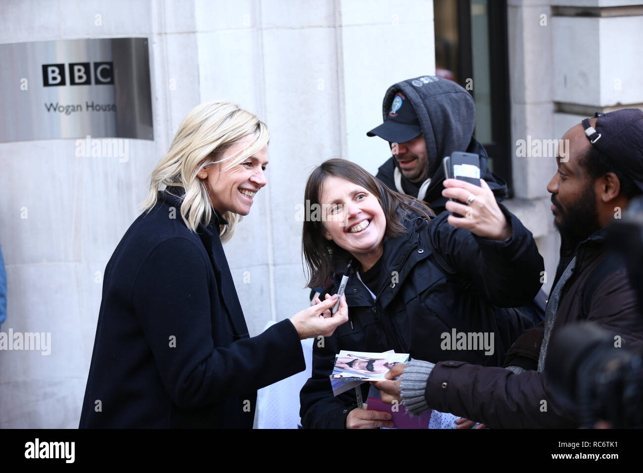 Zoe Ball (left) meets fans outside Wogan House in London after her first morning hosting the BBC 2 Breakfast Show. Stock Photo