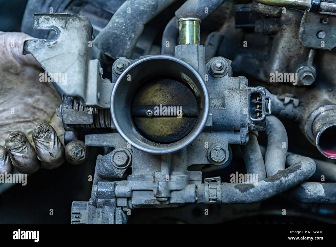 Closeup of the engine, throttle, raditor. Engine breakdown contaminated throttle of an old car