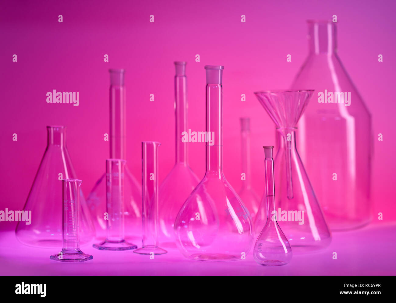 variety of laboratory glassware in violet ambiance Stock Photo Alamy
