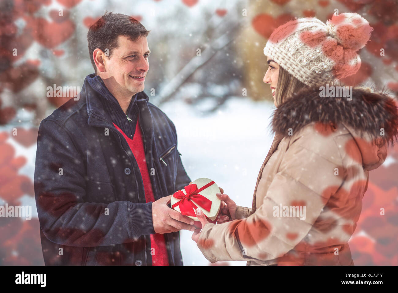 Guy Giving His Girlfriend Valentines Present For Holiday Stock