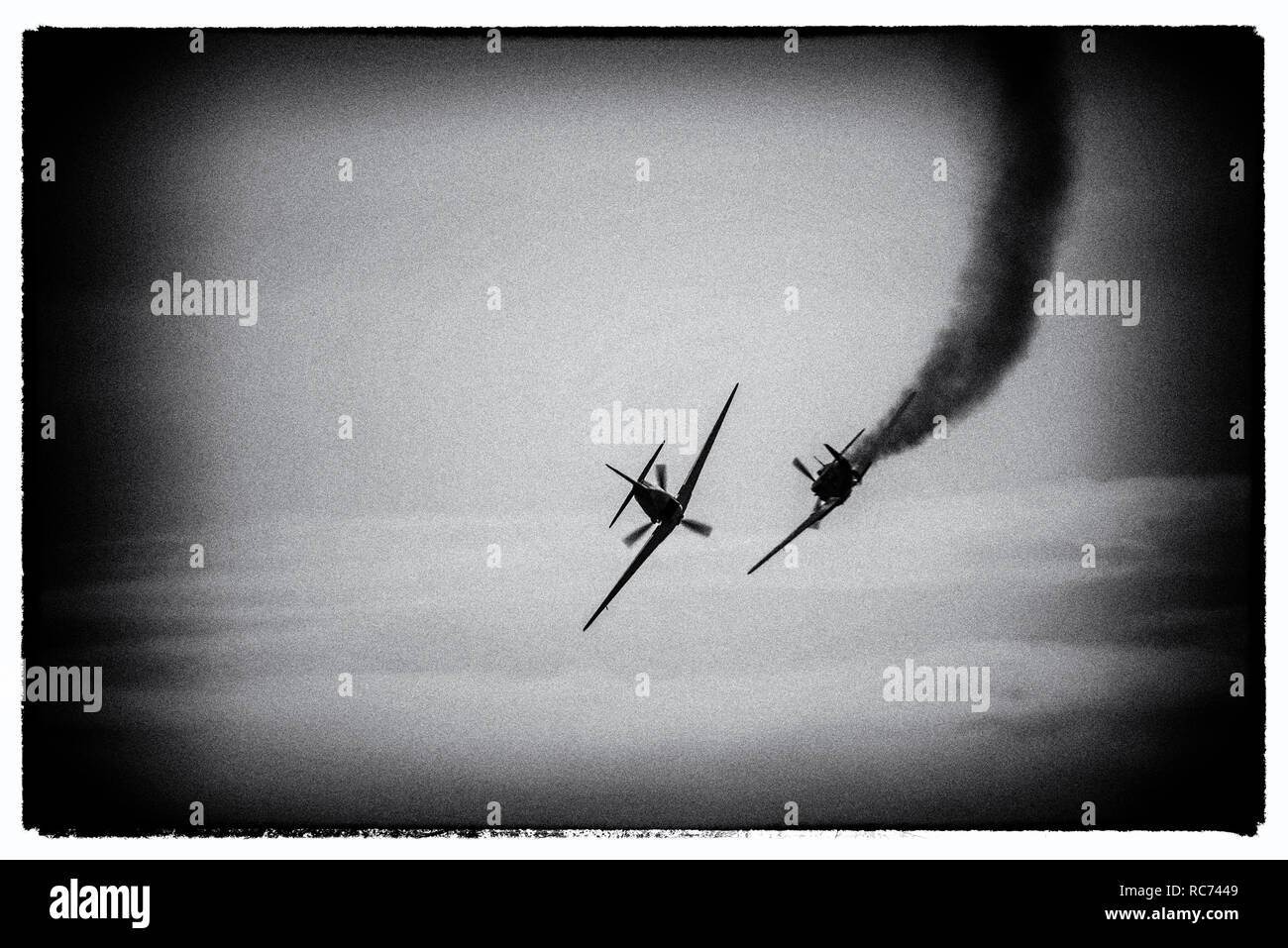 Second World War dogfight air warfare. A modern image processed to appear to show a gun camera photograph of World War Two air battle with plane smoke Stock Photo