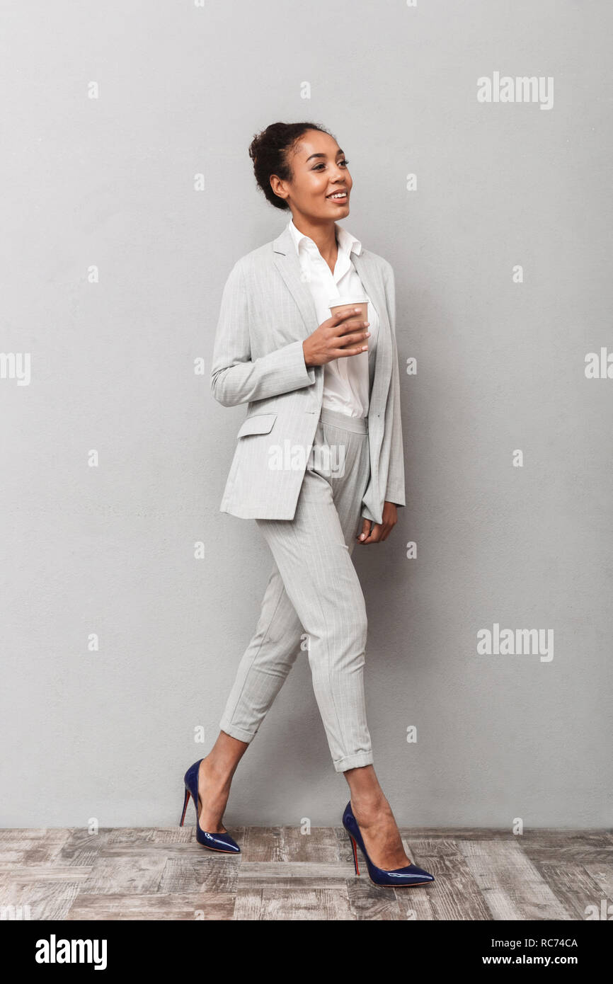 Full length portrait of a confident african business woman wearing suit ...