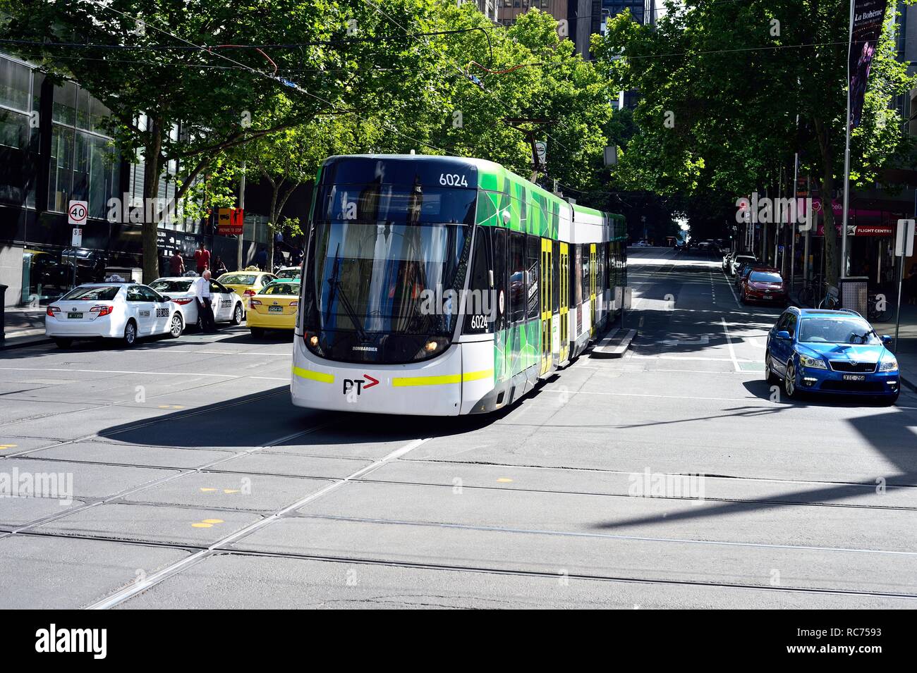 Melbourne tram traveling through city center Stock Photo