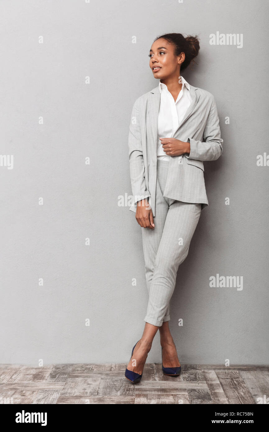 Full length portrait of a confident african business woman wearing suit ...