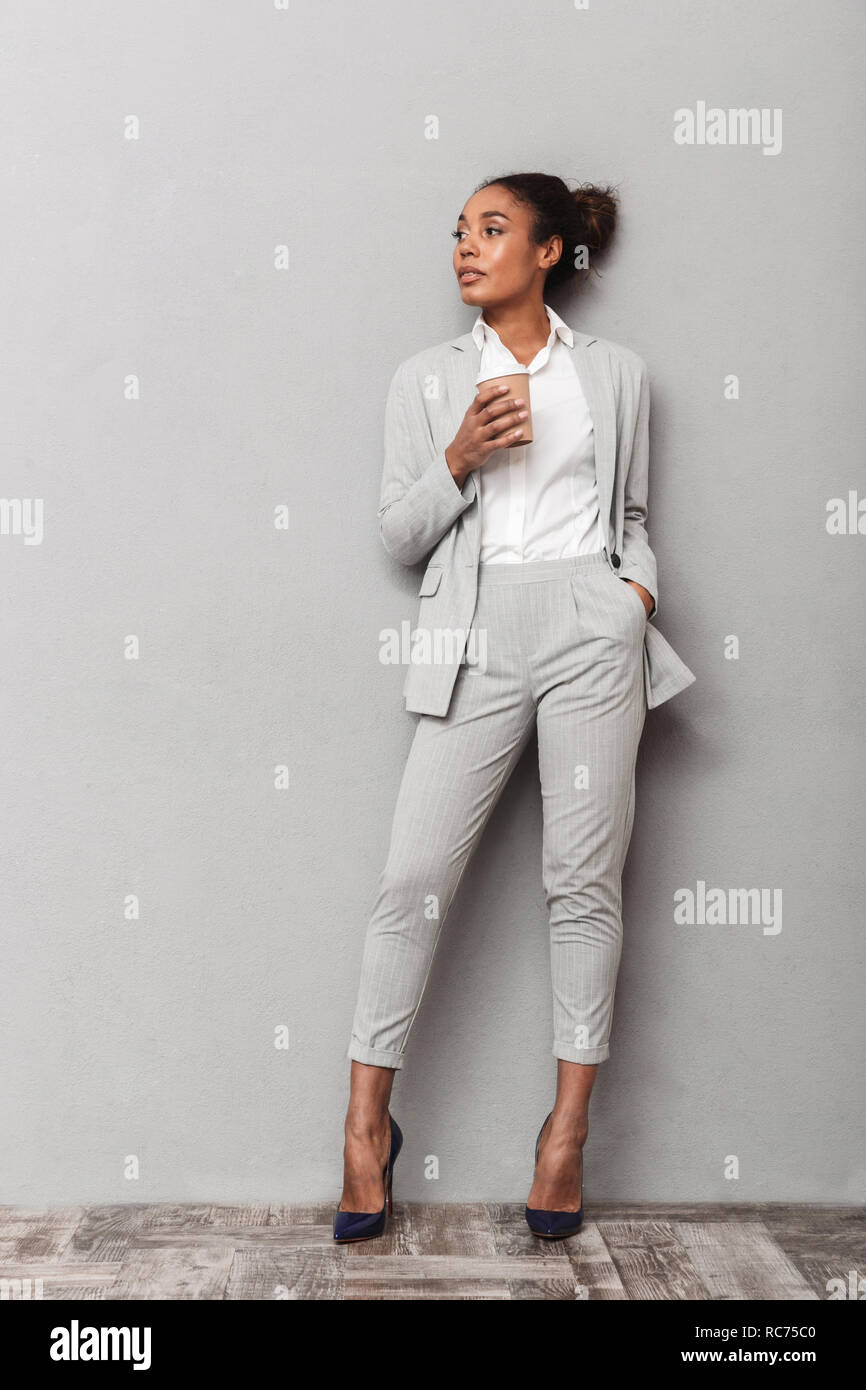 Full length portrait of a confident african business woman wearing suit ...