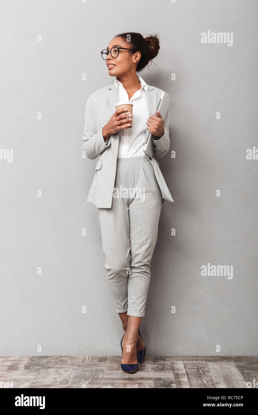 Full length portrait of a confident african business woman wearing suit ...
