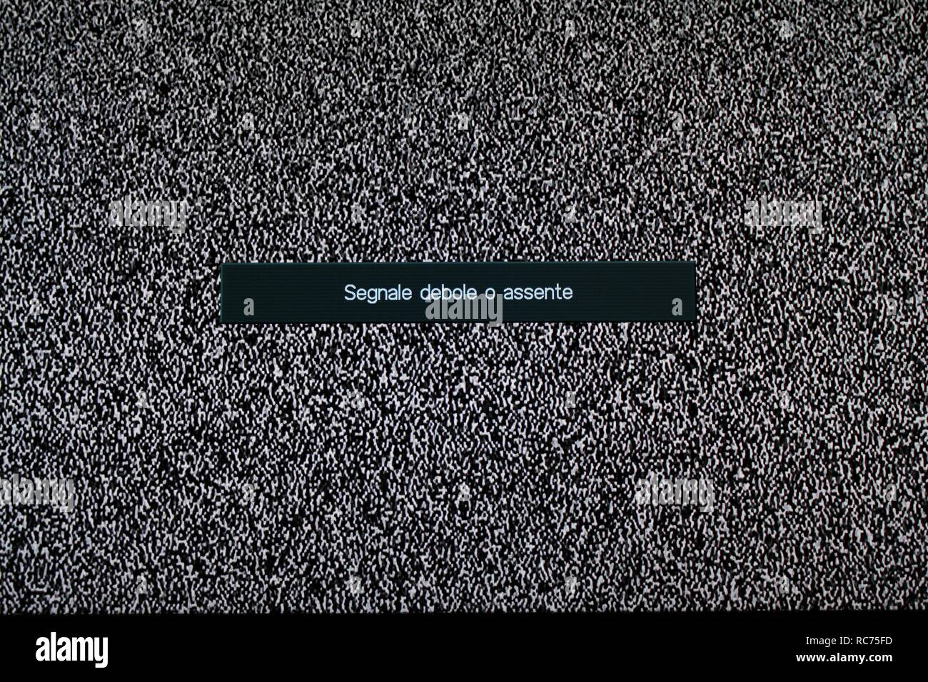 TV and remote control. White noise. Searching, installing or checking