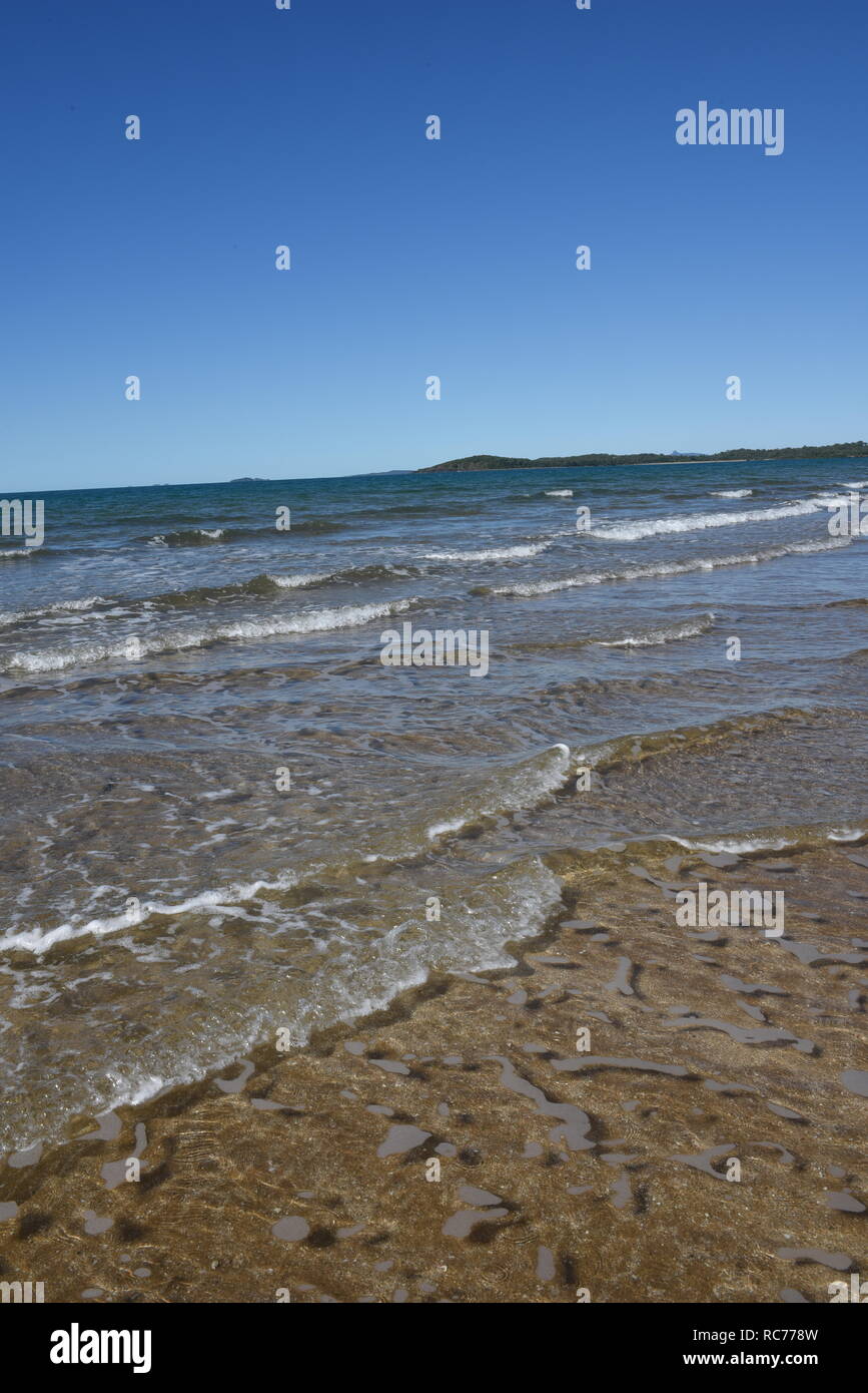 Waves and tides, Sarina Beach Stock Photo Alamy