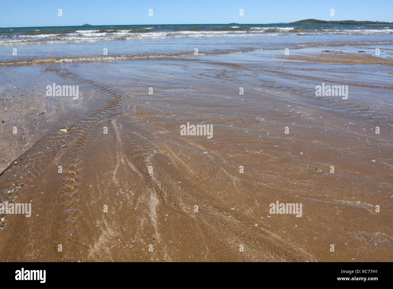 Waves and tides, Sarina Beach Stock Photo Alamy
