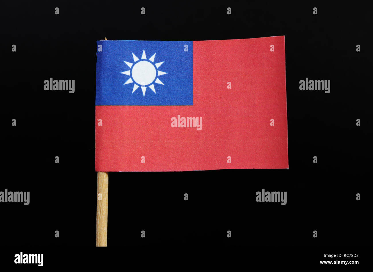 A National Flag Of Taiwan On Toothpick On Black Background A Red