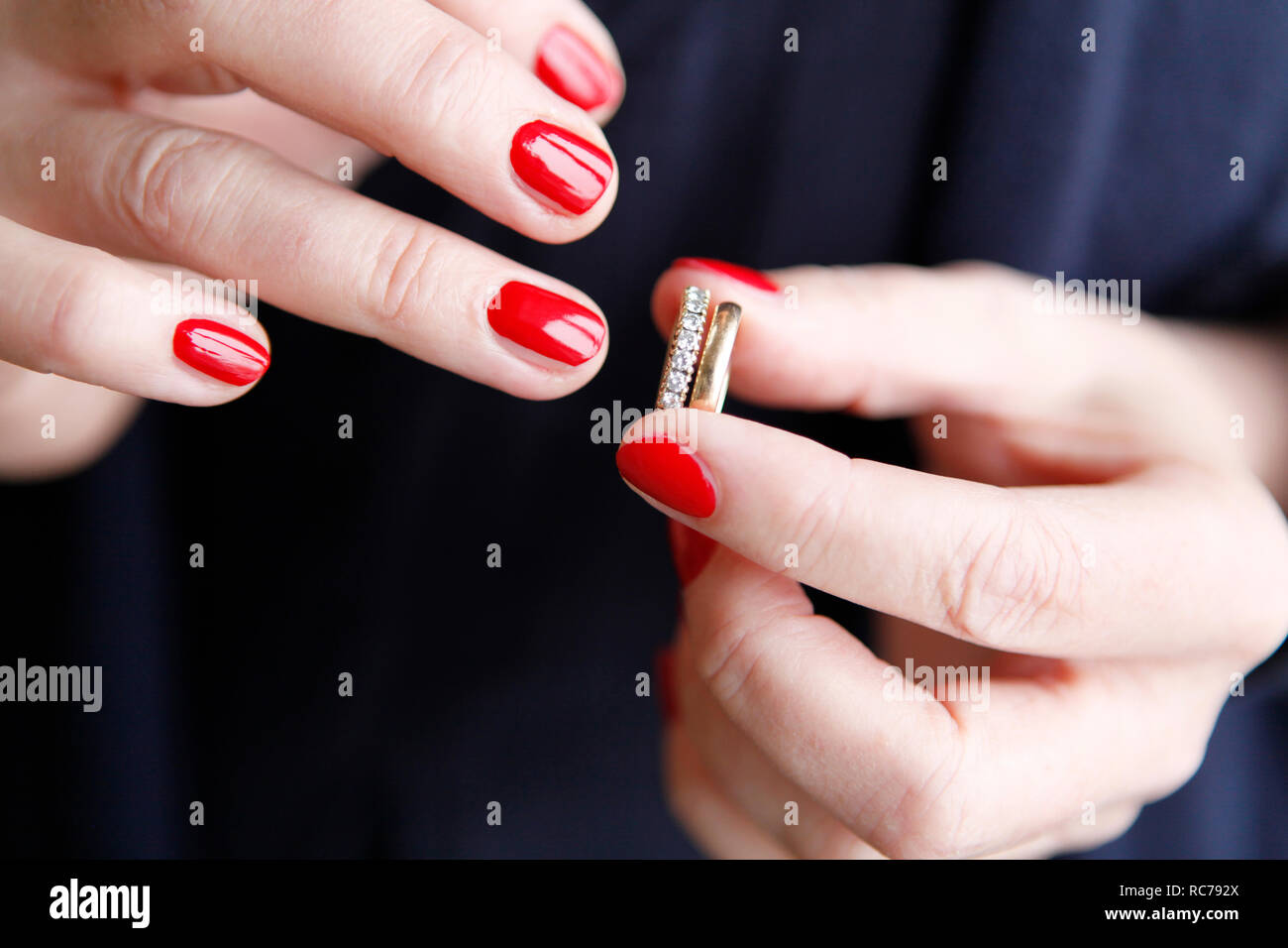 Woman putting on a ring Stock Photo