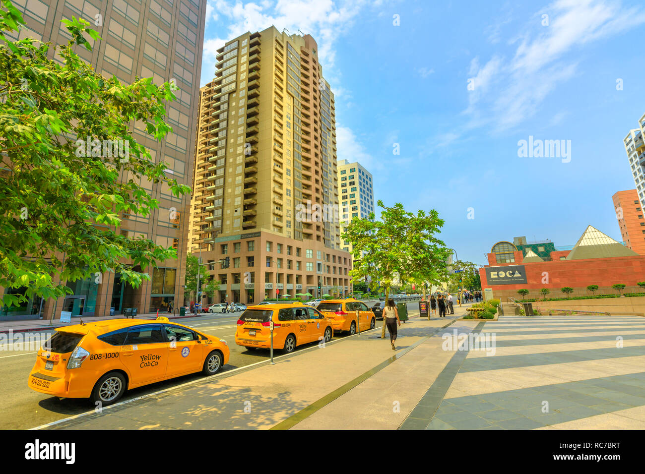 Los Angeles, California, United States - August 9, 2018: row of taxis on Grand Avenue in downtown Los Angeles, next to MOCA, the Museum of Contemporary Art in L.A. Blue sky in a sunny day. Stock Photo